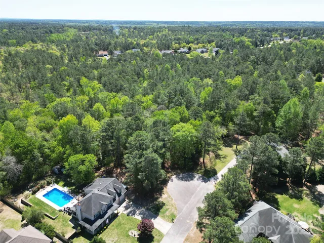 view of a forest with a houses