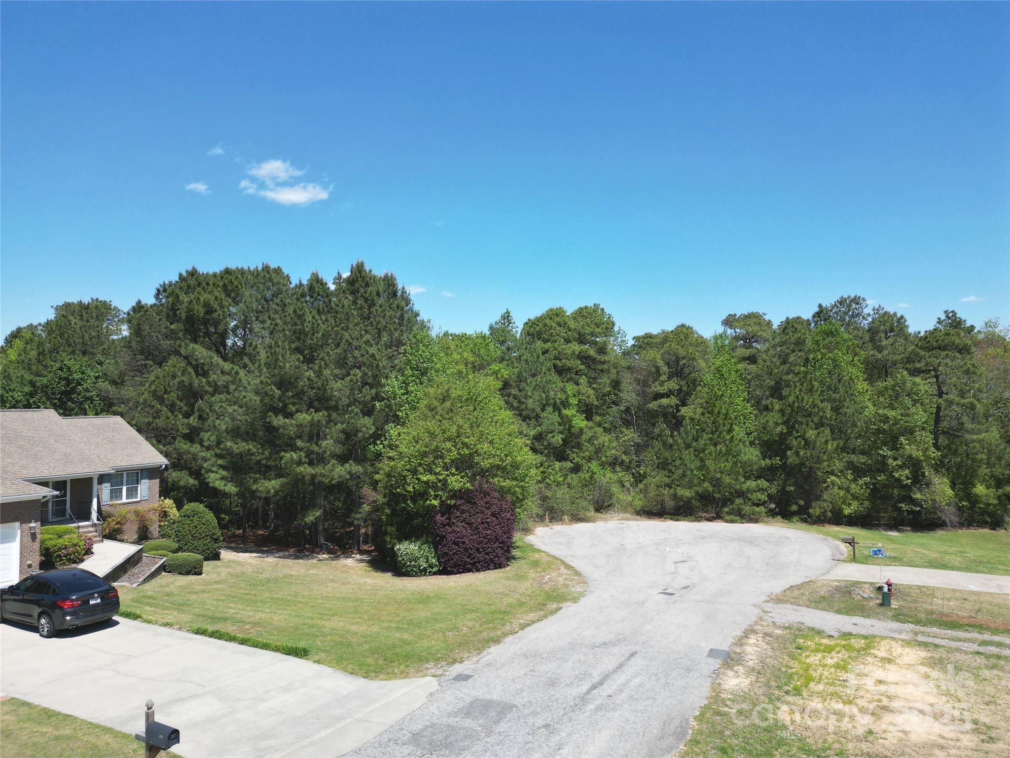 Tbd Queens Cove Way Carthage, NC 28327 - Photo 10 of 33 a view of a back yard of the house