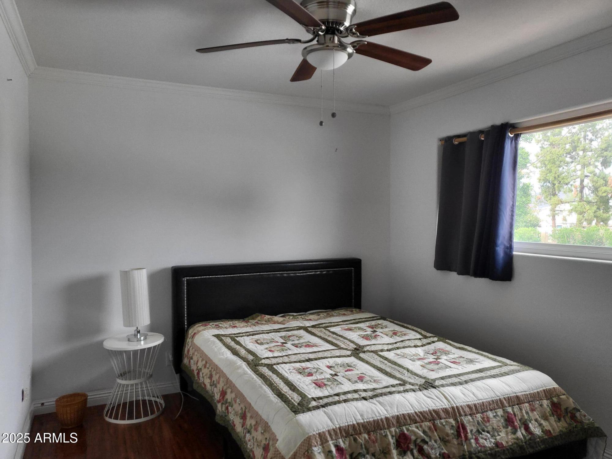 815 North Hayden Road, Unit D207 Scottsdale, AZ 85257 - Photo 19 of 29 a bedroom with a bed and window