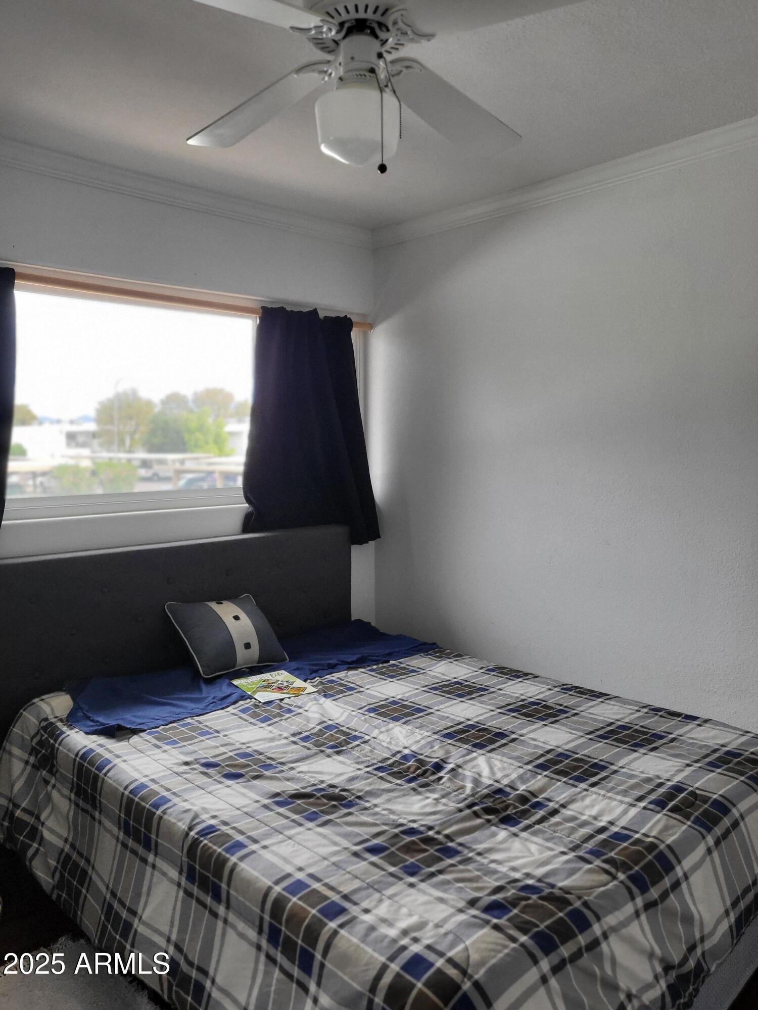 815 North Hayden Road, Unit D207 Scottsdale, AZ 85257 - Photo 22 of 29 a bedroom with a bed and window
