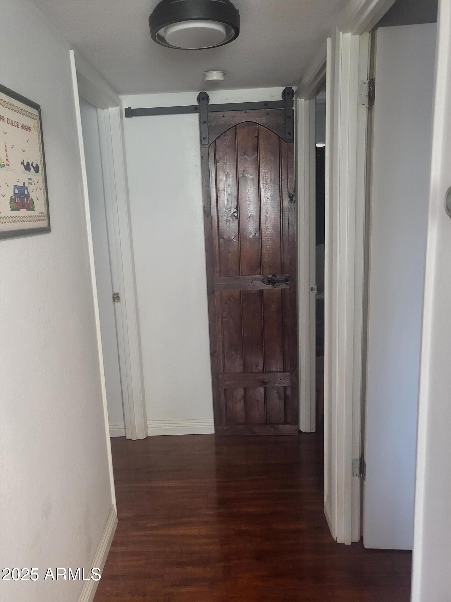 815 North Hayden Road, Unit D207 Scottsdale, AZ 85257 - Photo 23 of 29 a view of empty room with wooden floor