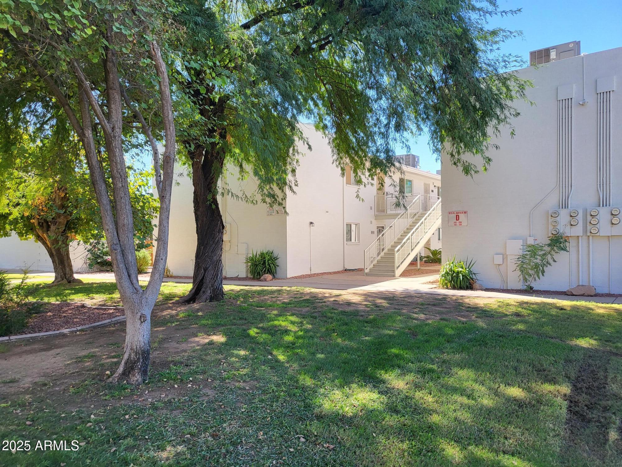 815 North Hayden Road, Unit D207 Scottsdale, AZ 85257 - Photo 25 of 29 a view of a house with a tree in the background
