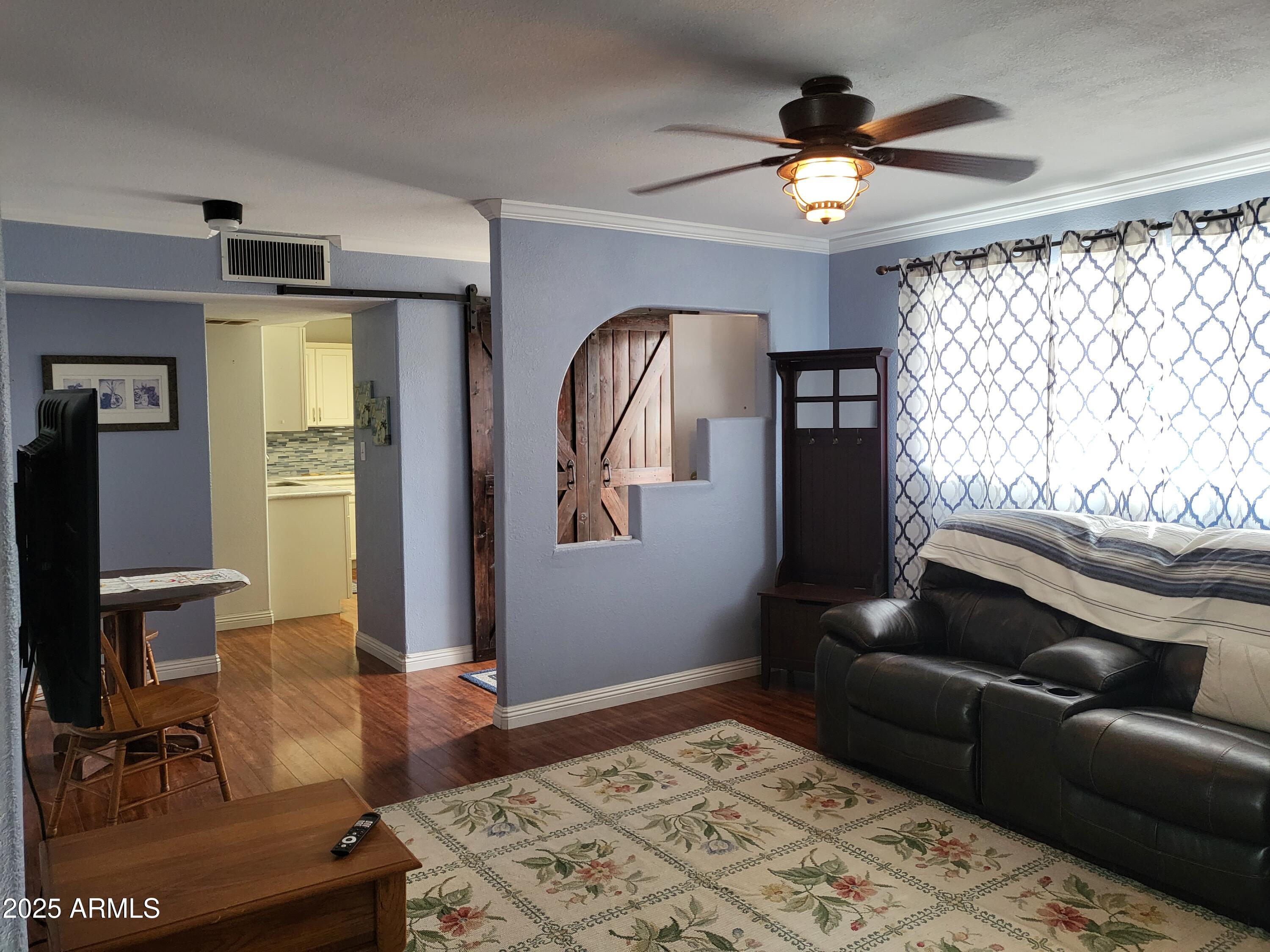 815 North Hayden Road, Unit D207 Scottsdale, AZ 85257 - Photo 3 of 29 a living room with furniture and a window