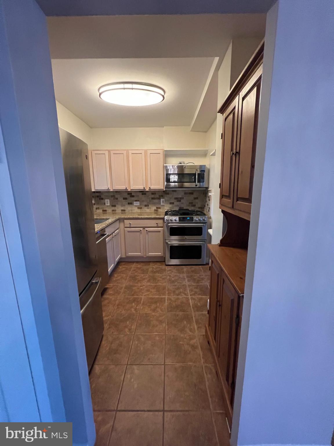 3222 Wellington Road Alexandria, VA 22302 - Photo 6 of 45 Opening from dining to kitchen