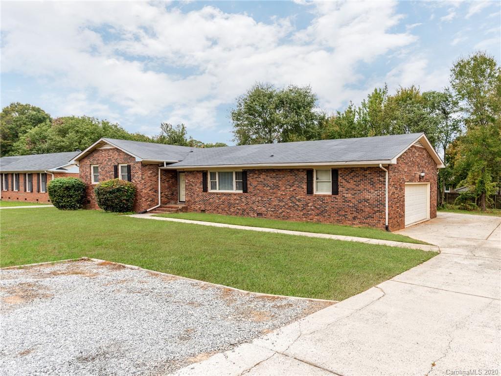 10128 Mt Holly Road Charlotte, NC 28214 - Photo 2 of 24 a front view of a house with a garden