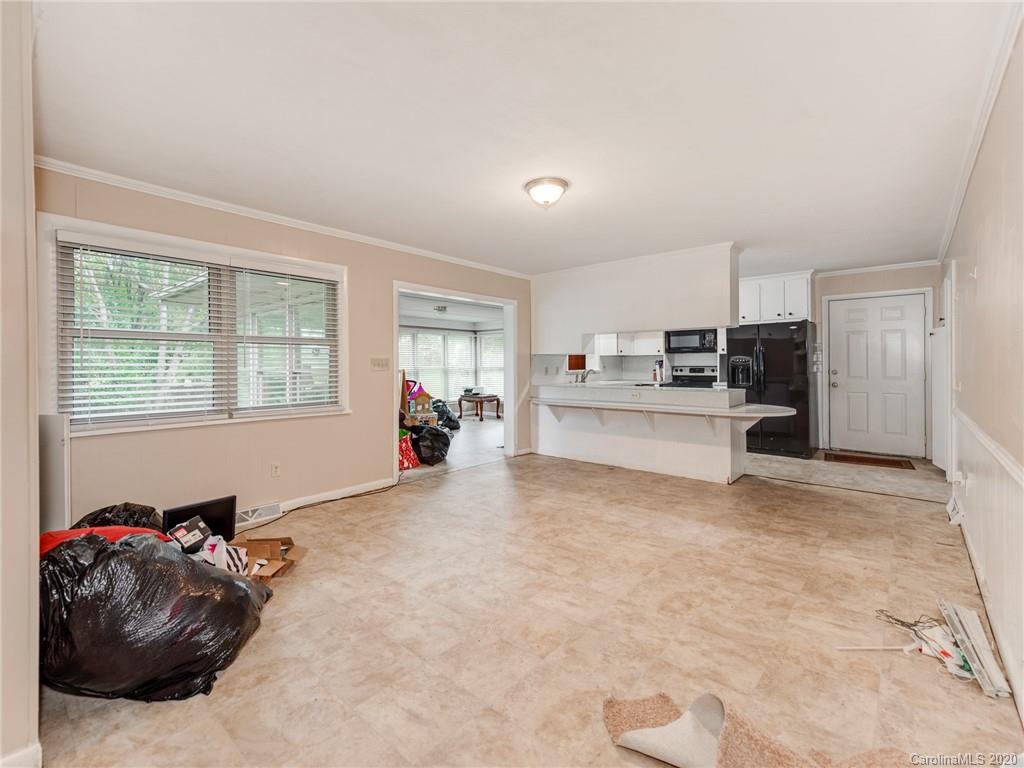 10128 Mt Holly Road Charlotte, NC 28214 - Photo 12 of 24 a living room with furniture and a large window