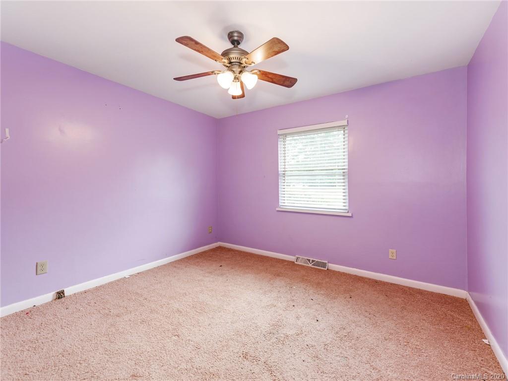 10128 Mt Holly Road Charlotte, NC 28214 - Photo 17 of 24 a view of a big room with windows