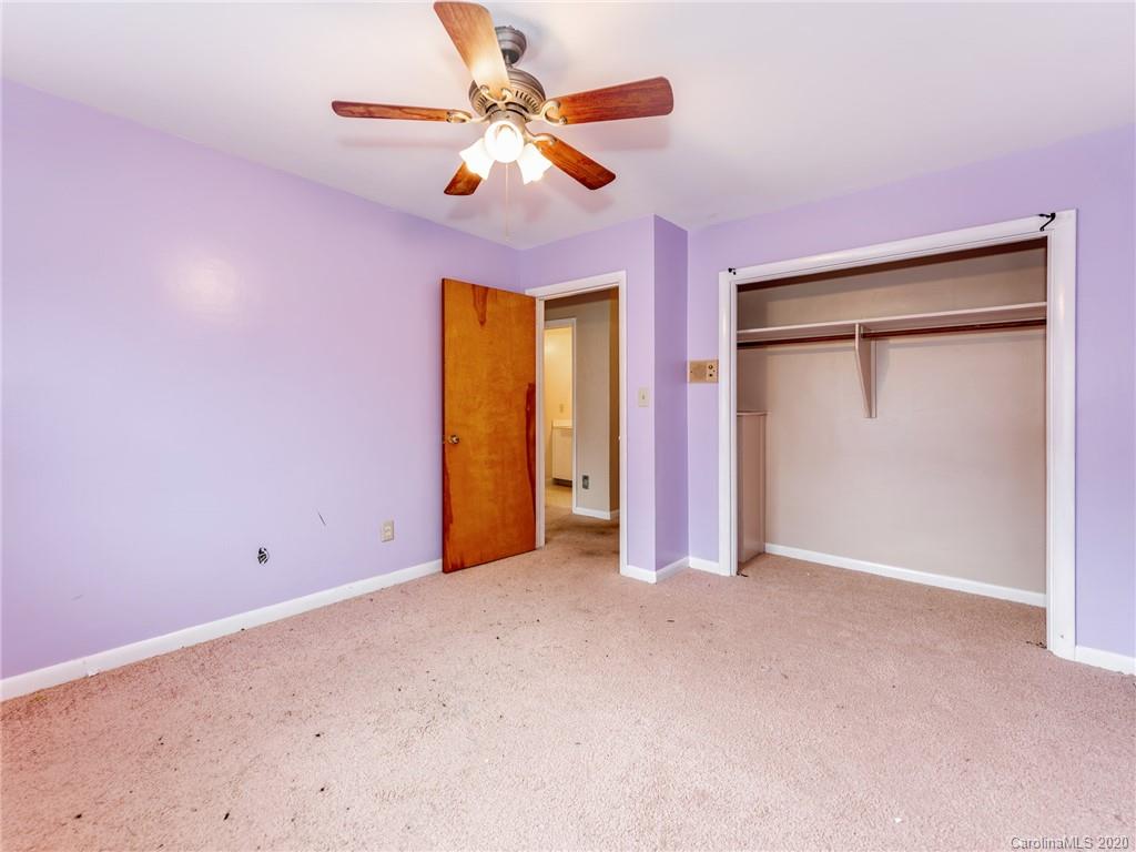 10128 Mt Holly Road Charlotte, NC 28214 - Photo 18 of 24 an empty room with closet and a chandelier fan