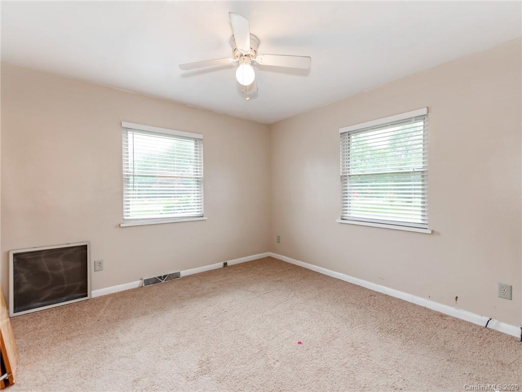 10128 Mt Holly Road Charlotte, NC 28214 - Photo 19 of 24 an empty room with windows and fan