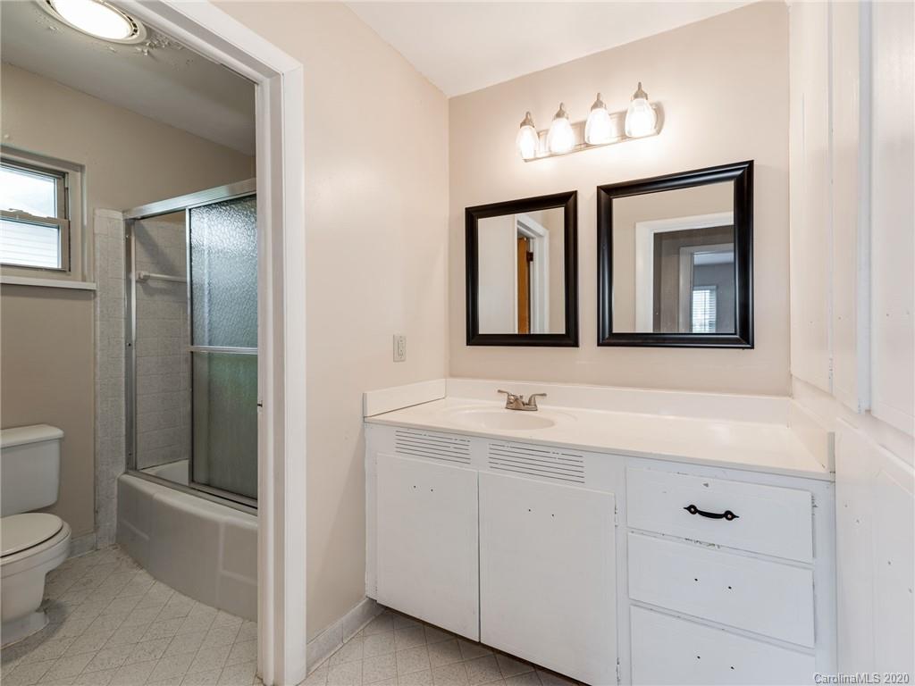 10128 Mt Holly Road Charlotte, NC 28214 - Photo 21 of 24 a bathroom with a toilet sink and mirror