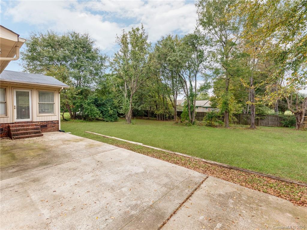 10128 Mt Holly Road Charlotte, NC 28214 - Photo 22 of 24 a view of a house with a big yard