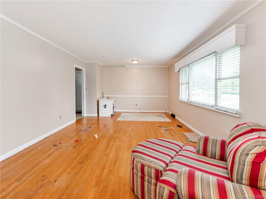 10128 Mt Holly Road Charlotte, NC 28214 - Photo 6 of 24 a spacious bedroom with a bed and a window