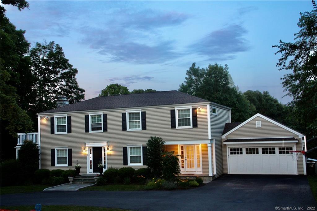58 Flat Rock Road Easton, CT 06612 - Photo 1 of 1 a front view of a house with a yard and garage