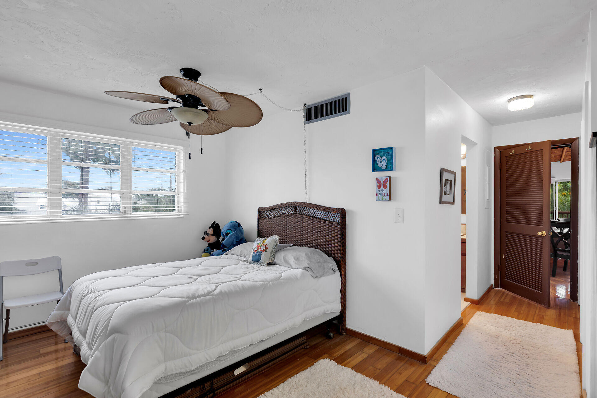 42 Treasure Road Marathon, FL 33050 - Photo 27 of 70 a bedroom with a bed and wooden floor