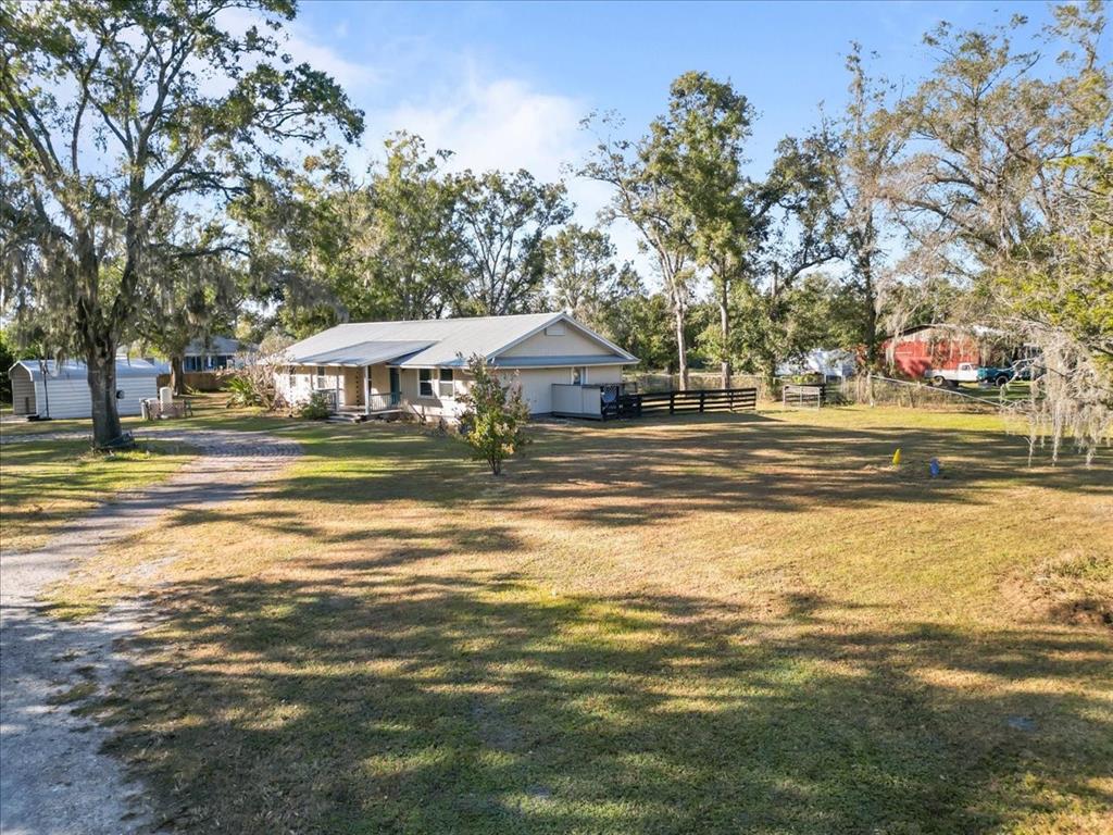 a swimming pool view with a outdoor seating