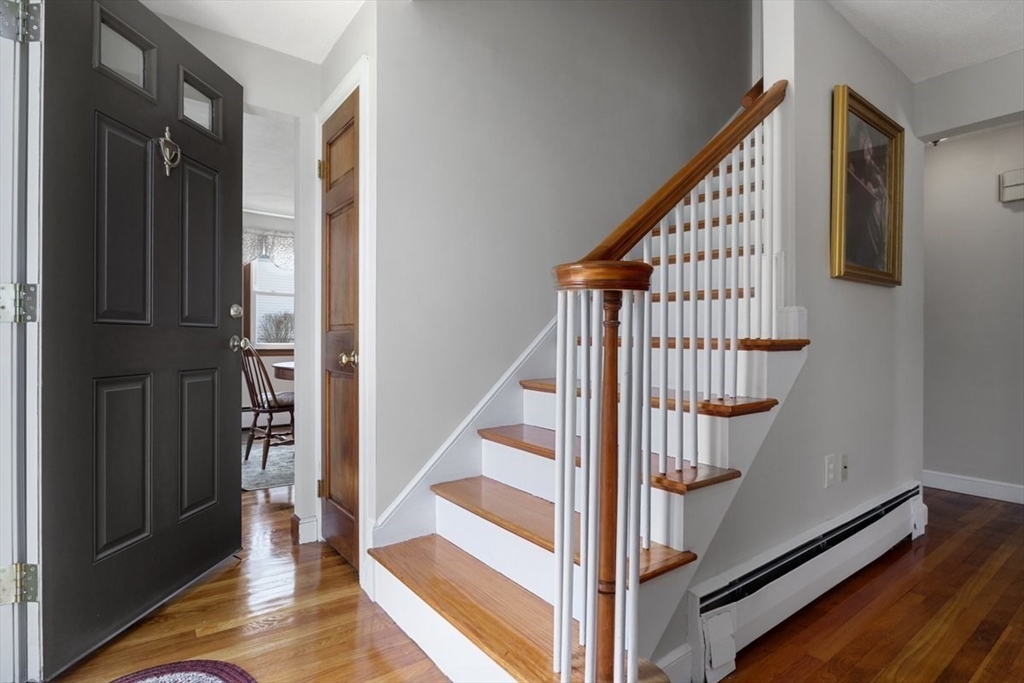 47 Irving Drive Walpole, MA 02081 - Photo 12 of 42 a view of entryway with wooden floor and stairs