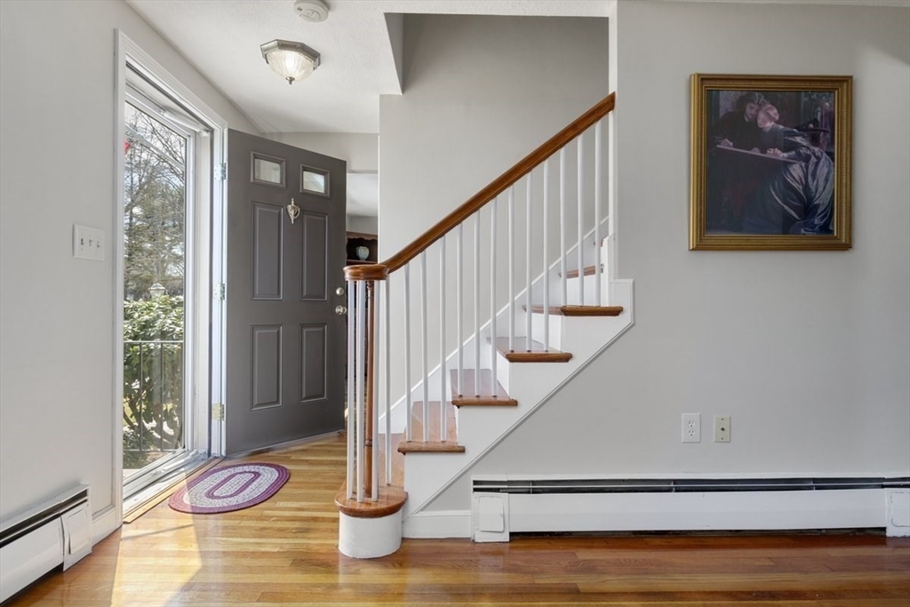 47 Irving Drive Walpole, MA 02081 - Photo 14 of 42 a view of entryway and hall with wooden floor