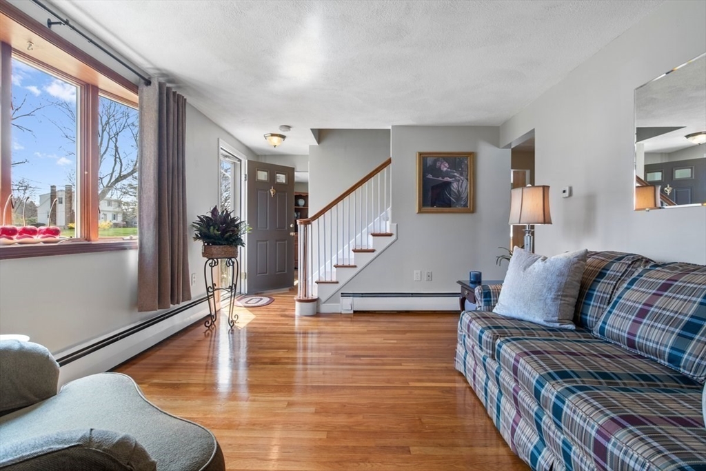 47 Irving Drive Walpole, MA 02081 - Photo 15 of 42 a living room with furniture and a wooden floor