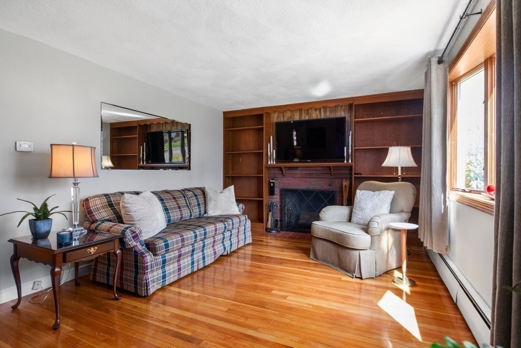 47 Irving Drive Walpole, MA 02081 - Photo 16 of 42 a living room with furniture and a flat screen tv