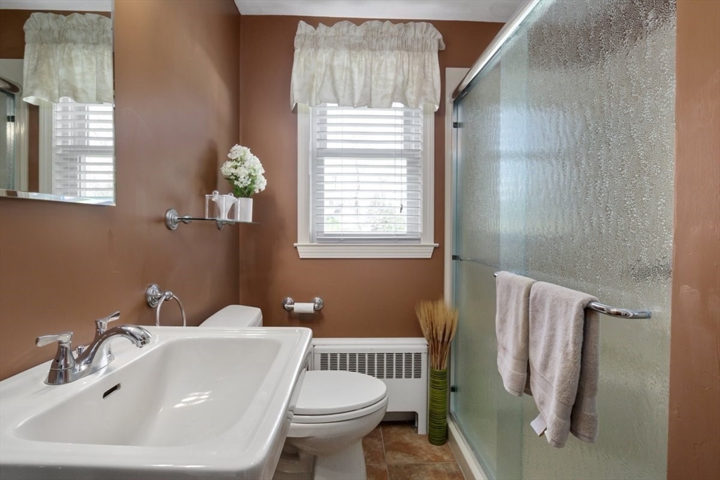 47 Irving Drive Walpole, MA 02081 - Photo 23 of 42 a bathroom with a sink toilet and a mirror