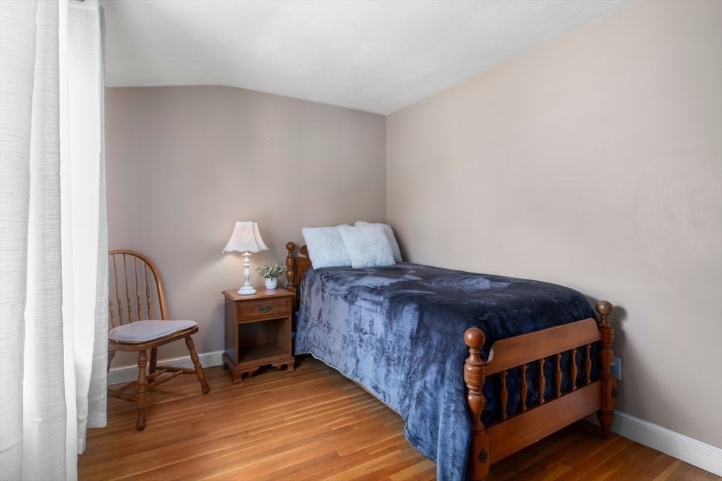 47 Irving Drive Walpole, MA 02081 - Photo 28 of 42 a bedroom with a bed and a table