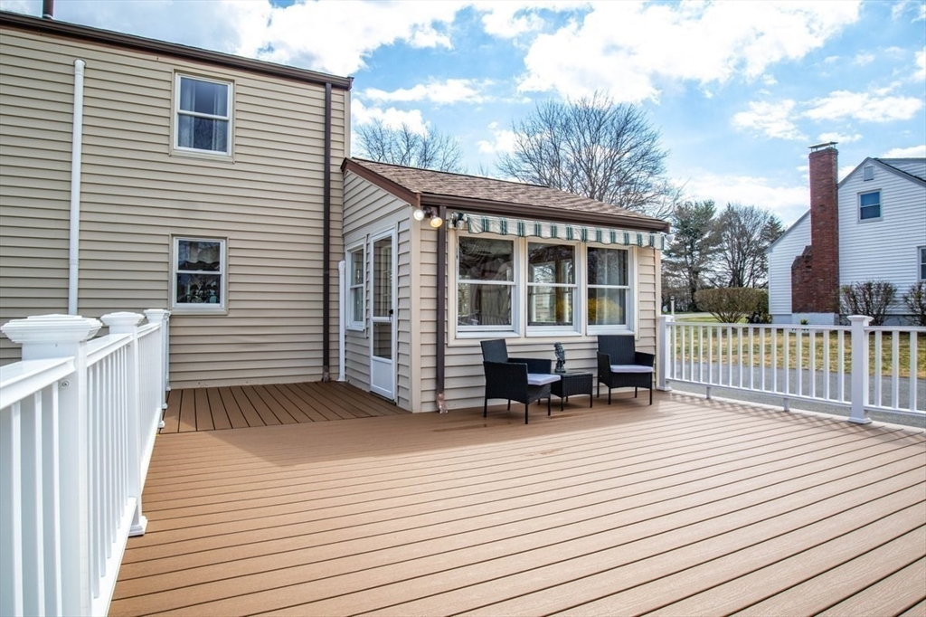 47 Irving Drive Walpole, MA 02081 - Photo 35 of 42 a backyard of a house with seating space