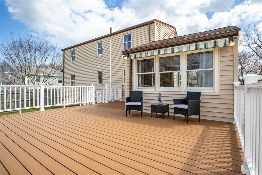 47 Irving Drive Walpole, MA 02081 - Photo 36 of 42 a backyard of a house with seating space
