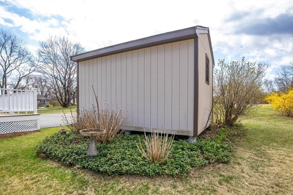 47 Irving Drive Walpole, MA 02081 - Photo 39 of 42 a view of a back yard of the house