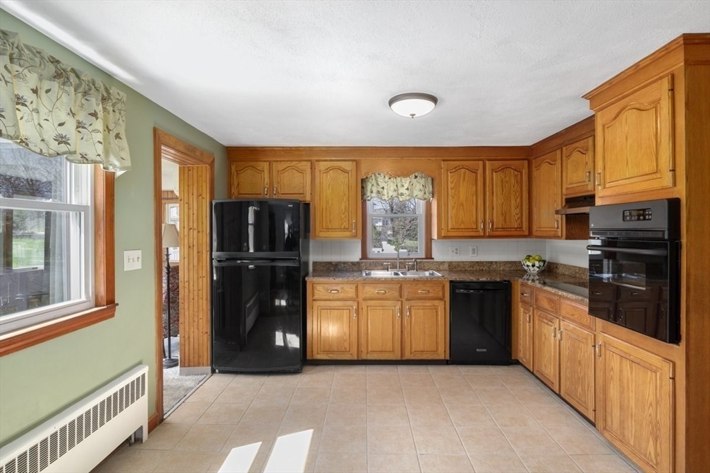 47 Irving Drive Walpole, MA 02081 - Photo 4 of 42 a kitchen with stainless steel appliances granite countertop a refrigerator and a stove top oven