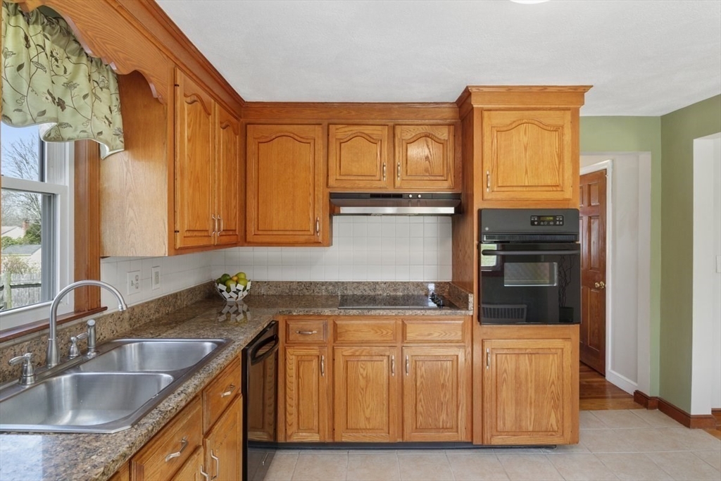47 Irving Drive Walpole, MA 02081 - Photo 5 of 42 a kitchen with stainless steel appliances granite countertop a refrigerator and a sink