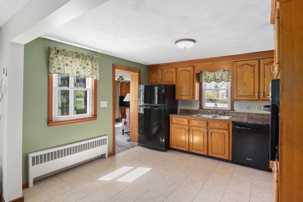 47 Irving Drive Walpole, MA 02081 - Photo 7 of 42 a kitchen with stainless steel appliances granite countertop a refrigerator and sink