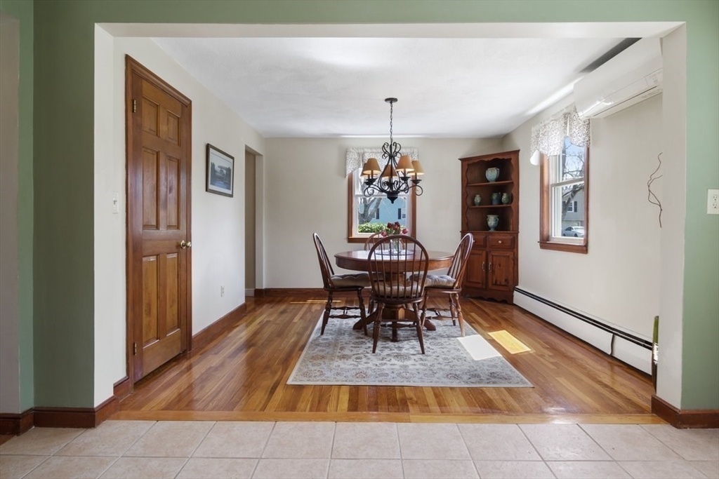 47 Irving Drive Walpole, MA 02081 - Photo 8 of 42 a dining room with a table and chairs