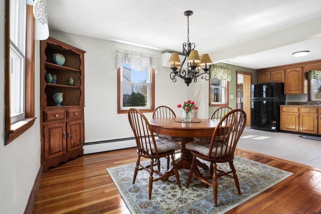 47 Irving Drive Walpole, MA 02081 - Photo 10 of 42 a view of a dining room with furniture and chandelier