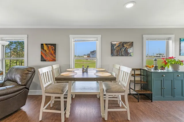 a kitchen with sink cabinets and wooden floor