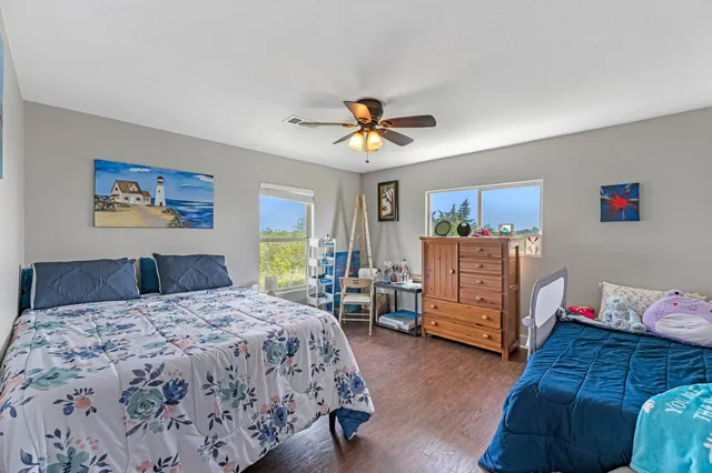 a view of a dining room with furniture wooden floor and window