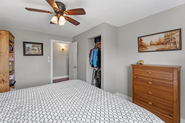 a bedroom with a bed and closet