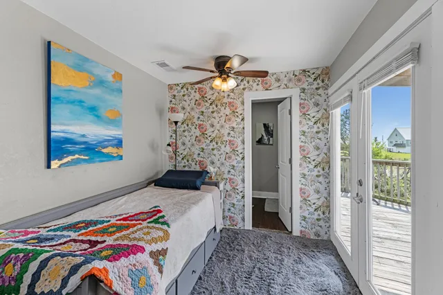 a bedroom with a bed and a mirror