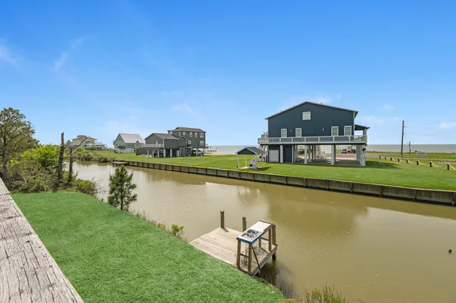 a front view of a house with a lake view