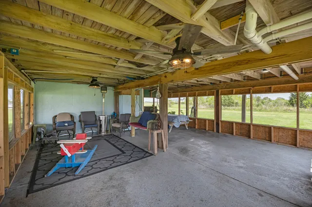 a view of a room with wooden ceiling