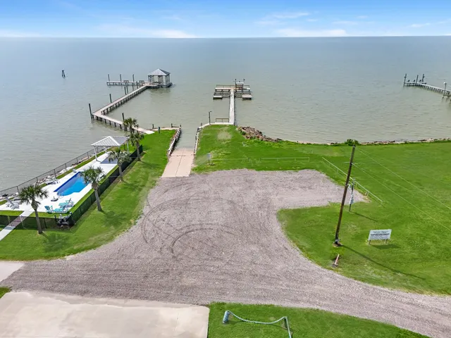 a view of a swimming pool with a yard