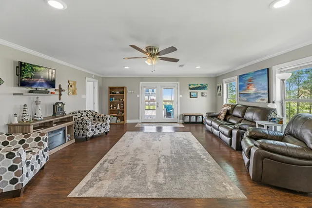 a living room with furniture rug and window