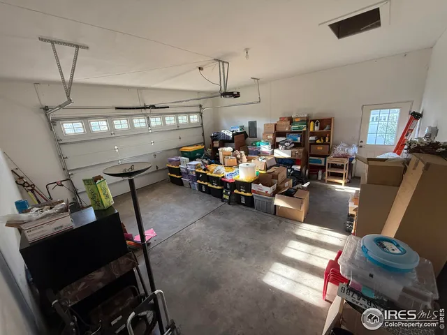 a living room with lots of furniture and gym equipment