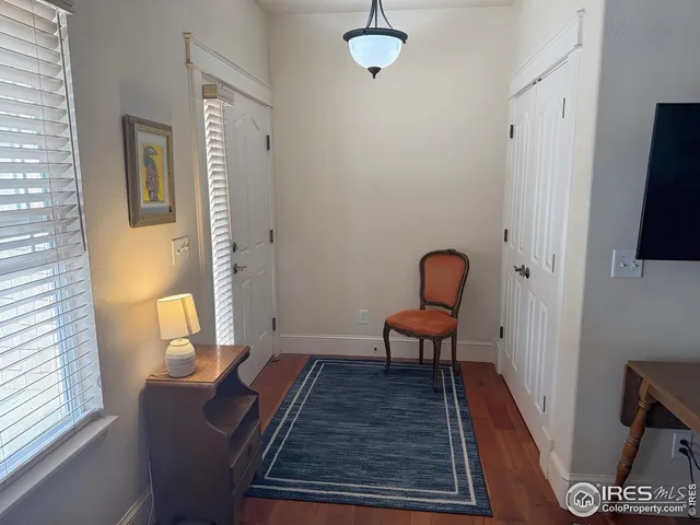 a living room with furniture and a rug