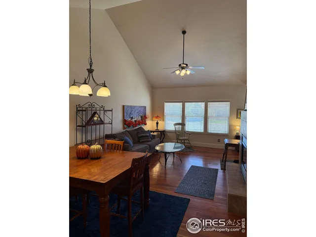 a view of a dining room with furniture and window