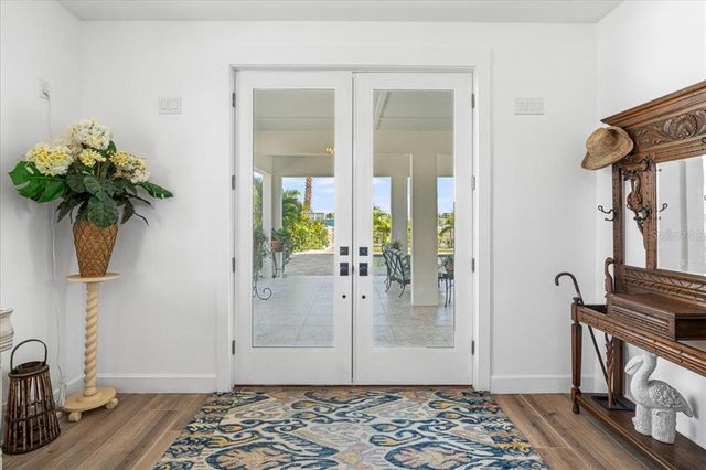 a view of a hallway view with wooden floor and staircase