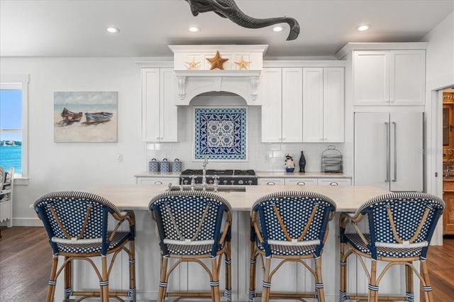 a view of a chairs and table in the balcony