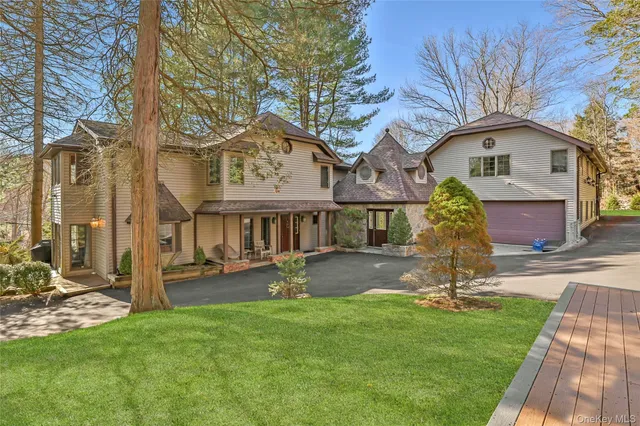 a front view of house with a garden
