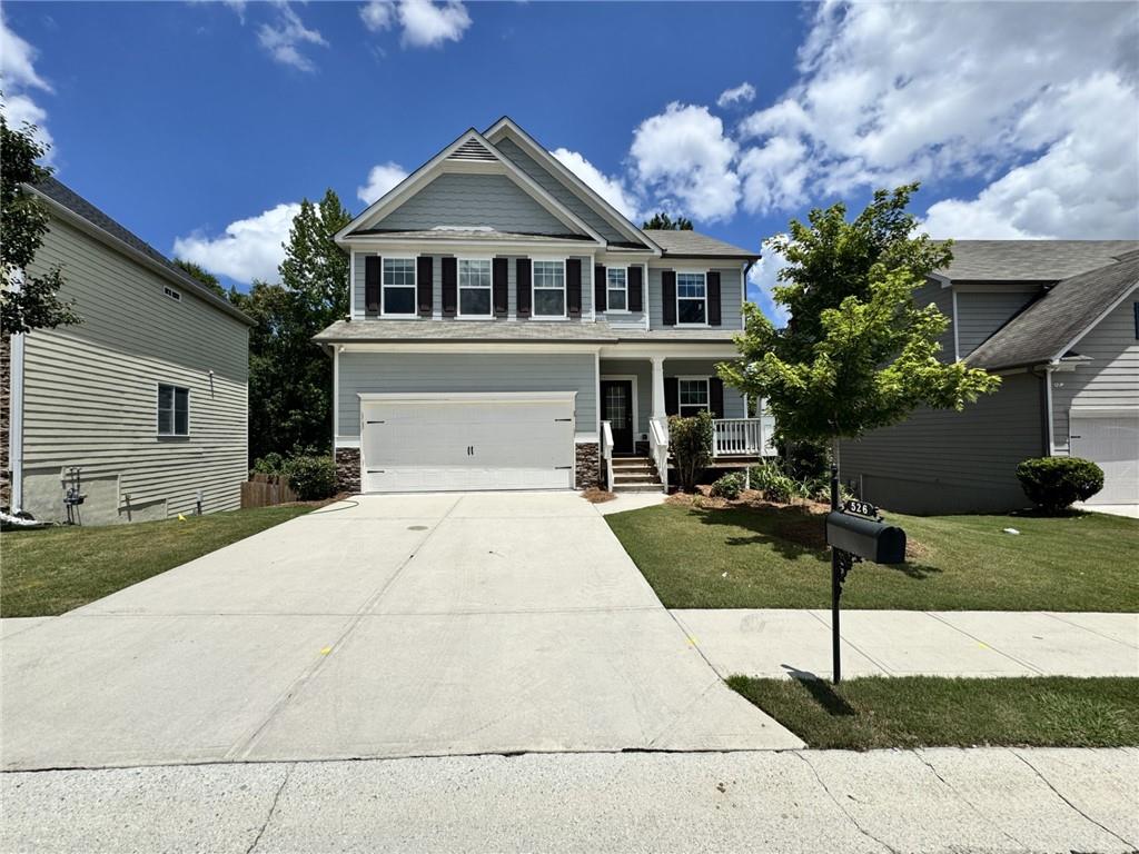 526 South Fortune Way Dallas, GA 30157 - Photo 1 of 1 a front view of a house with garden