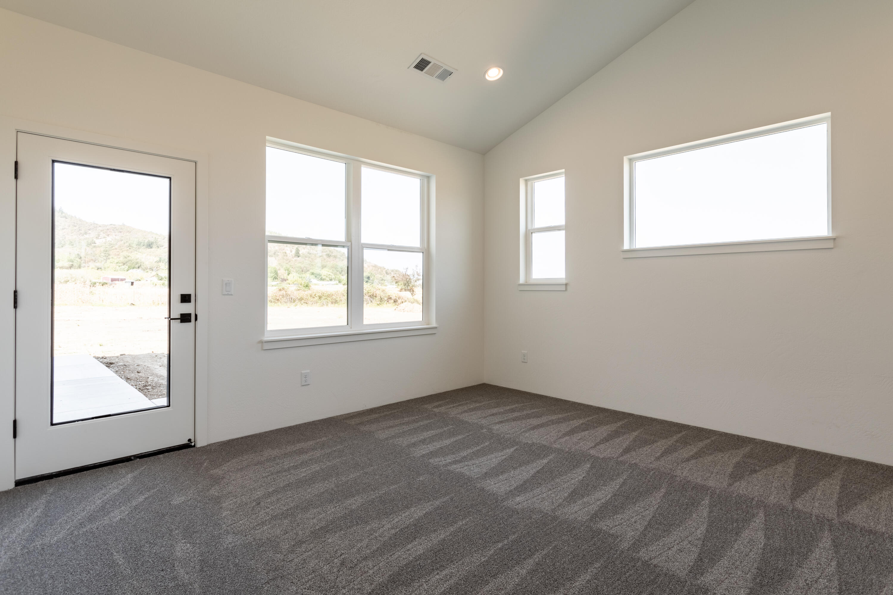 5607 Colver Road Talent, OR 97540 - Photo 13 of 34 a view of an empty room with a window