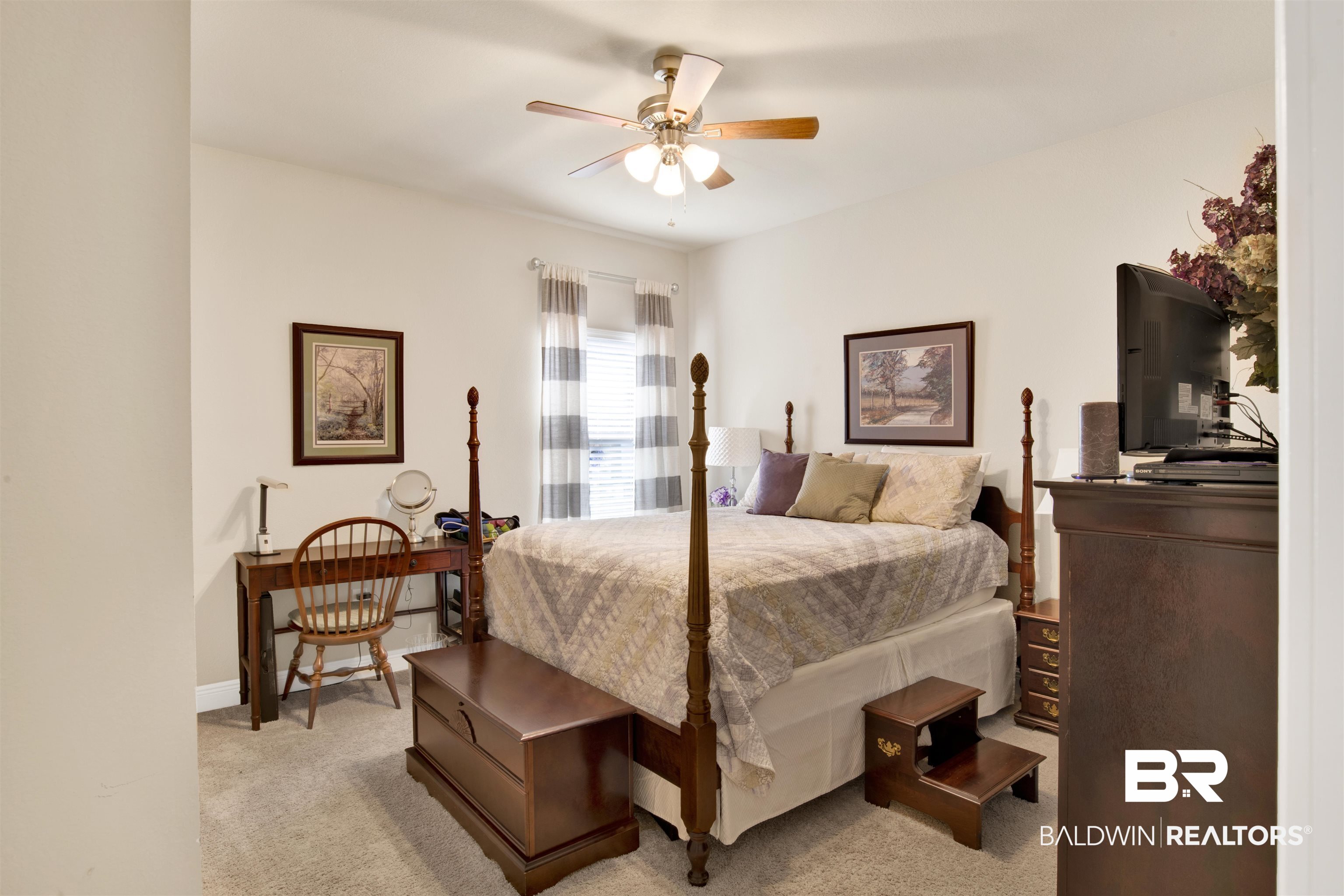1476 Surrey Loop Foley, AL 36535 - Photo 26 of 31 Bedroom with light colored carpet and ceiling fan